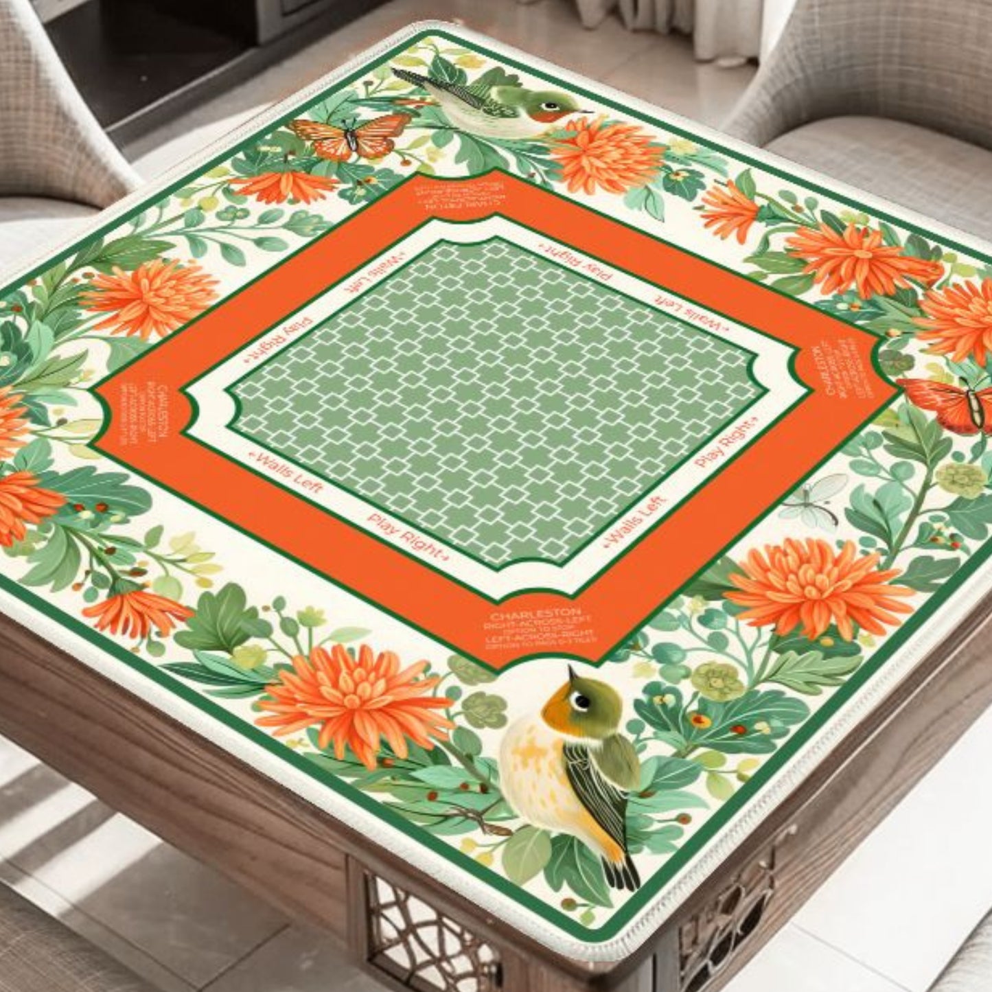 Garden Aviary floral bird mahjong mat on table with orange flowers and butterflies