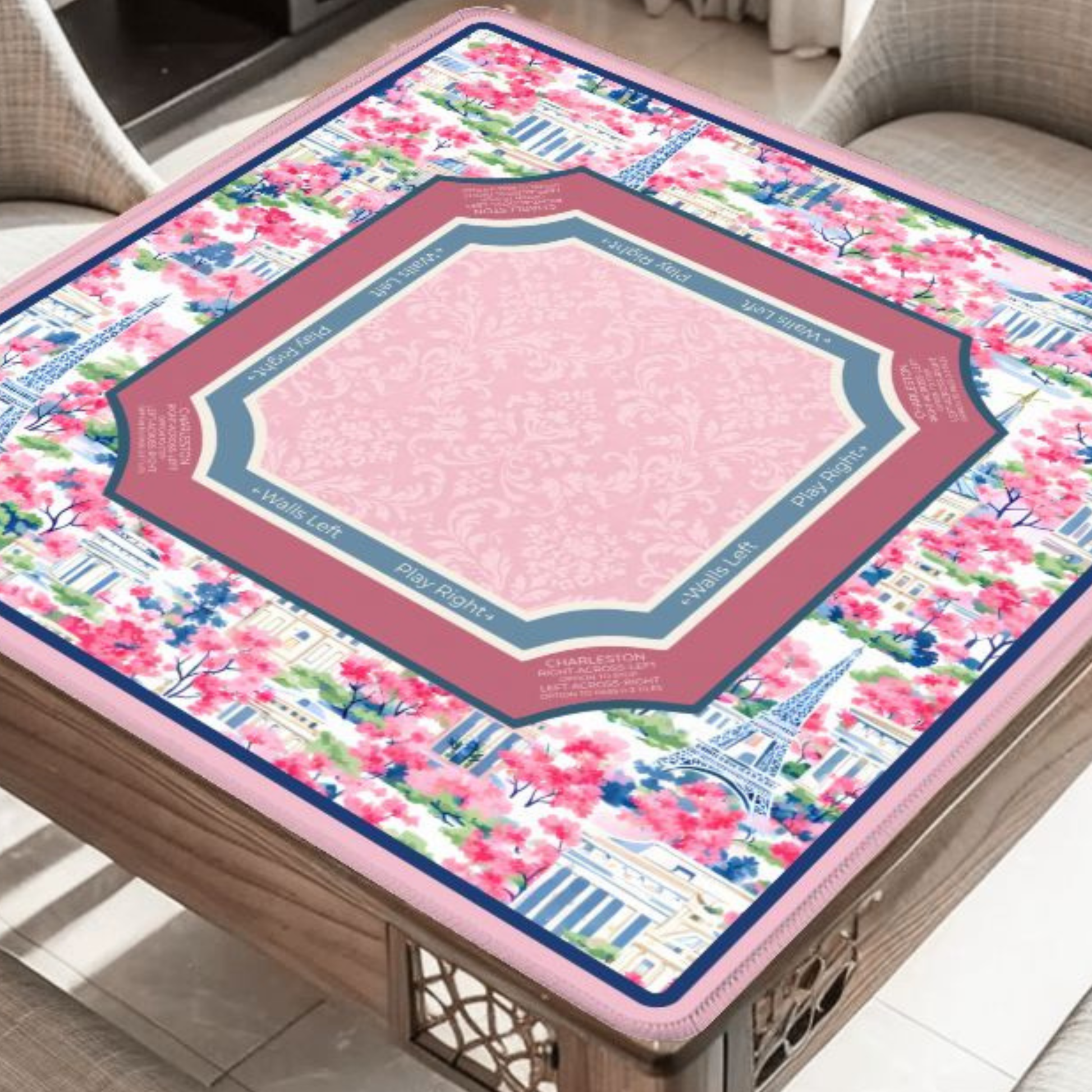 Paris Conservatory mahjong mat on table with Paris landmarks and cherry blossoms
